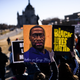 People march near the Minnesota State Capitol to honor George Floyd on March 19, 2021 in St Paul, Minnesota. This morning Judge Peter Cahill rejected motions for change of venue and continuance by the defense of former Minneapolis Police officer Derek Chauvin, who is accused of killing George Floyd last May.